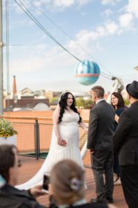 photography of wedding couple getting married at the boathouse at disney springs