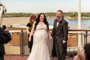 photography of wedding couple getting married at the boathouse at disney springs