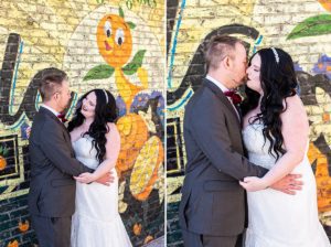 photo of wedding couple in front of painted brick wall after getting married at disney springs