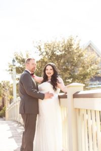 photography of bride and groom on bridge at disney springs