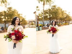 photography of bride in the sunshine holding red roses wedding bouquet at disney springs