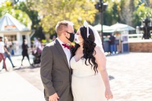 photography of wedding couple in the sunshine at disney springs