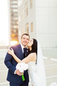 photo of wedding couple at sunrise on the roof of parking garage in downtown orlando