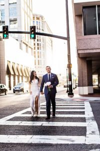 photo of couple crossing the road before courthouse wedding in downtown orlando