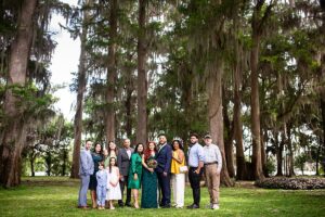 picture of family infront of cypress trees in winter park at kraft azalea garden