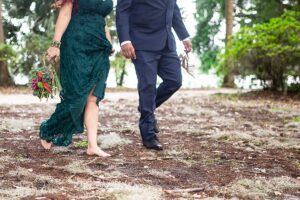couple walking barefoot at kraft azalea garden in winter park