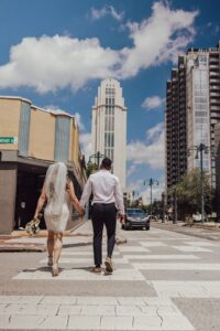 a couple walking to the orange county courthouse to get married