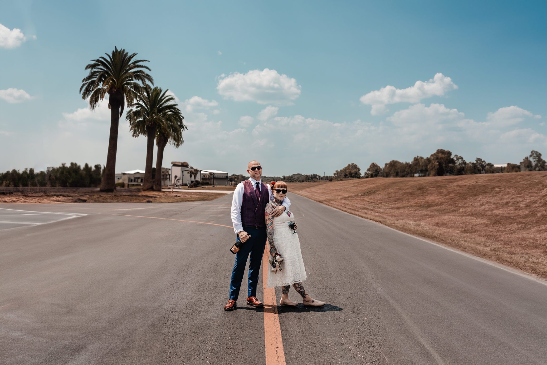 wedding couple posed on the runway of a private airport in apopka
