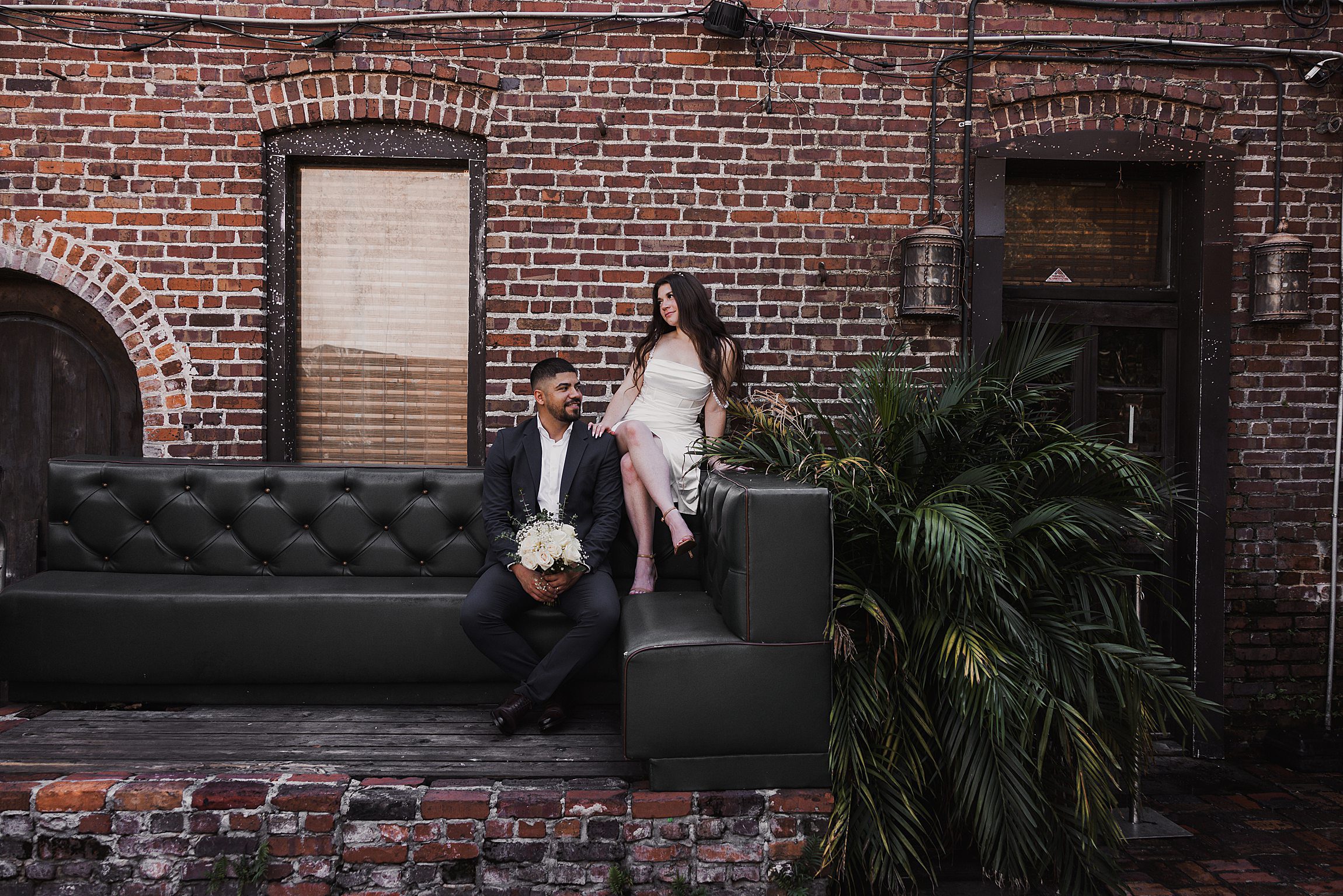 couple posing after their elopement at the orange county courthouse