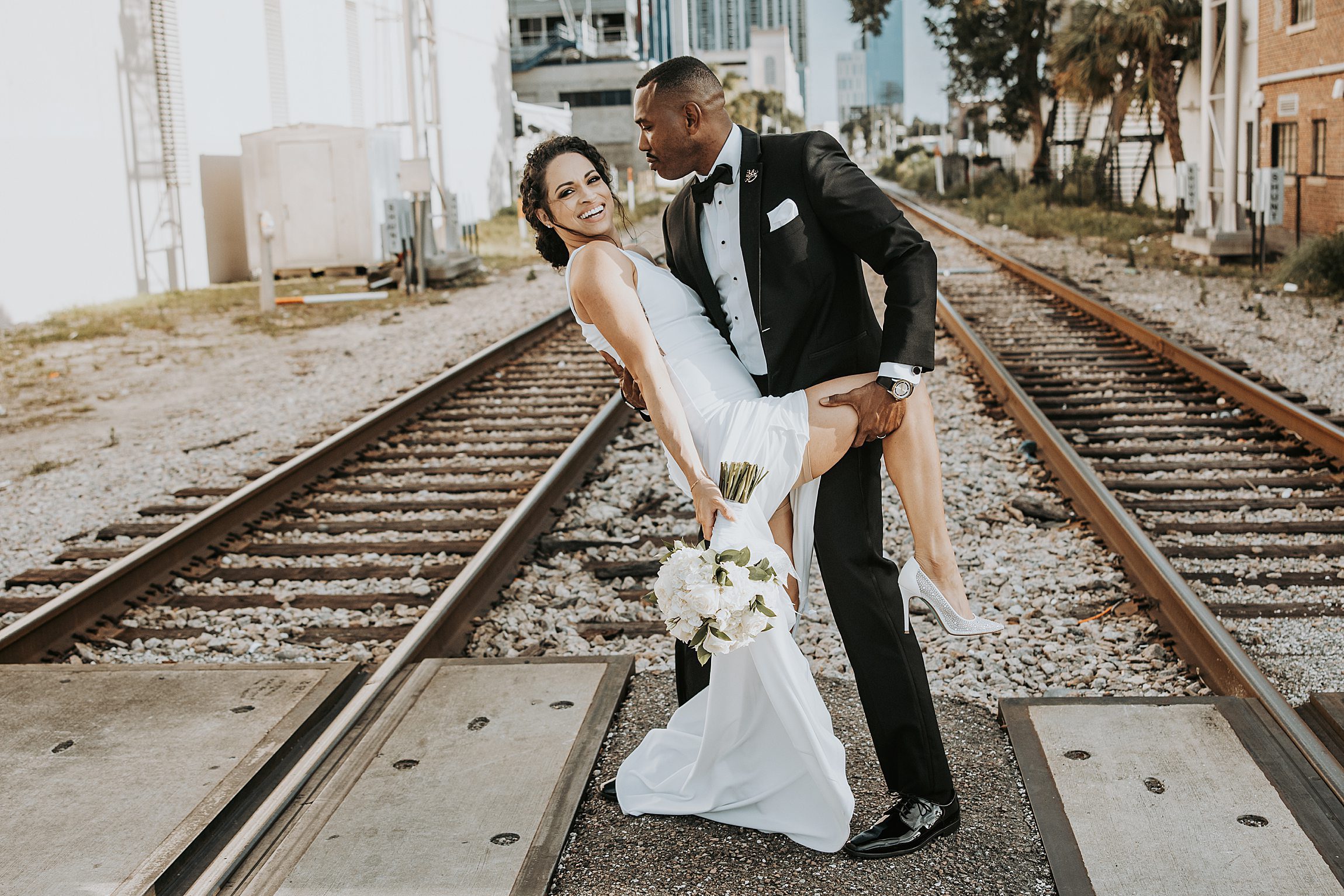 couple posing after their downtown orlando micro wedding at dovecote