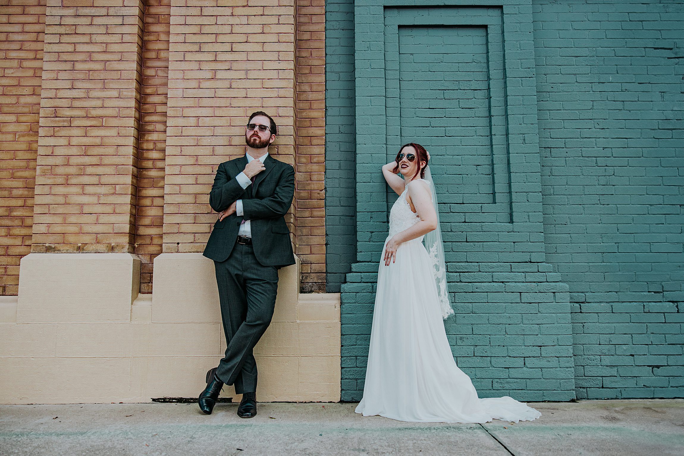 couple posing in downtown deland after their wedding at the volusia county courthouse