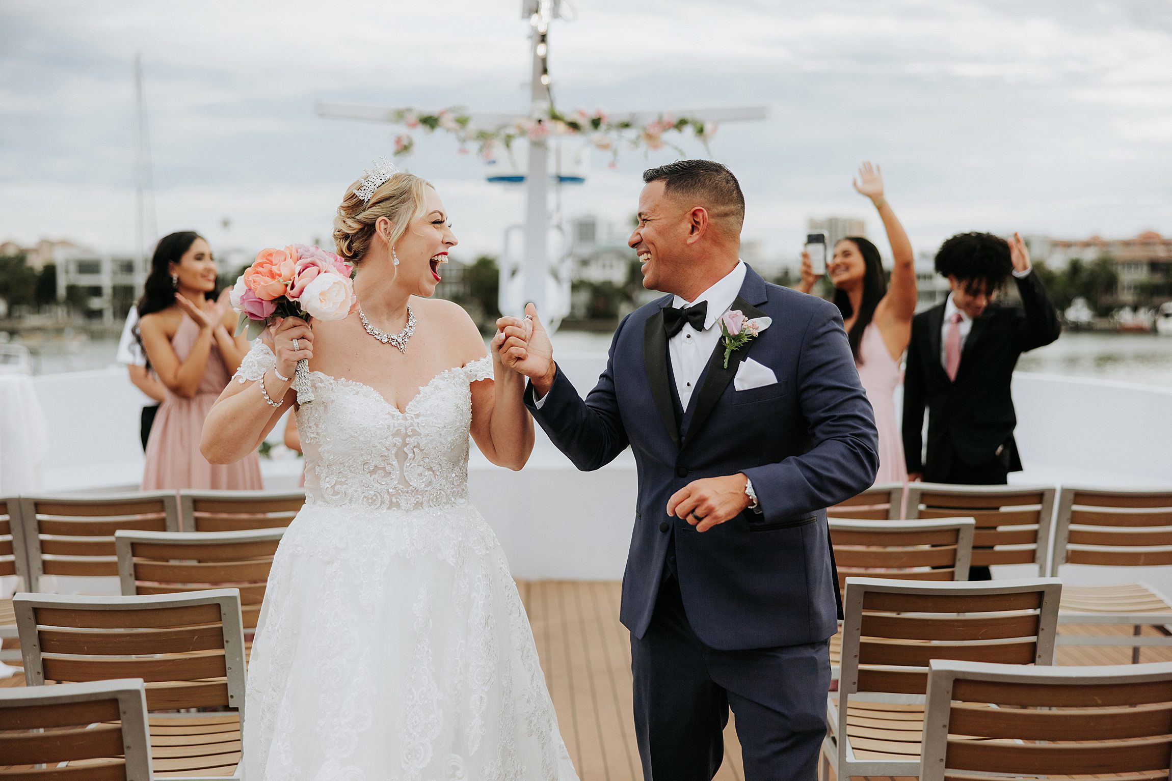 a couple walk up the aisle after their wedding on the starship yacht in clearwater