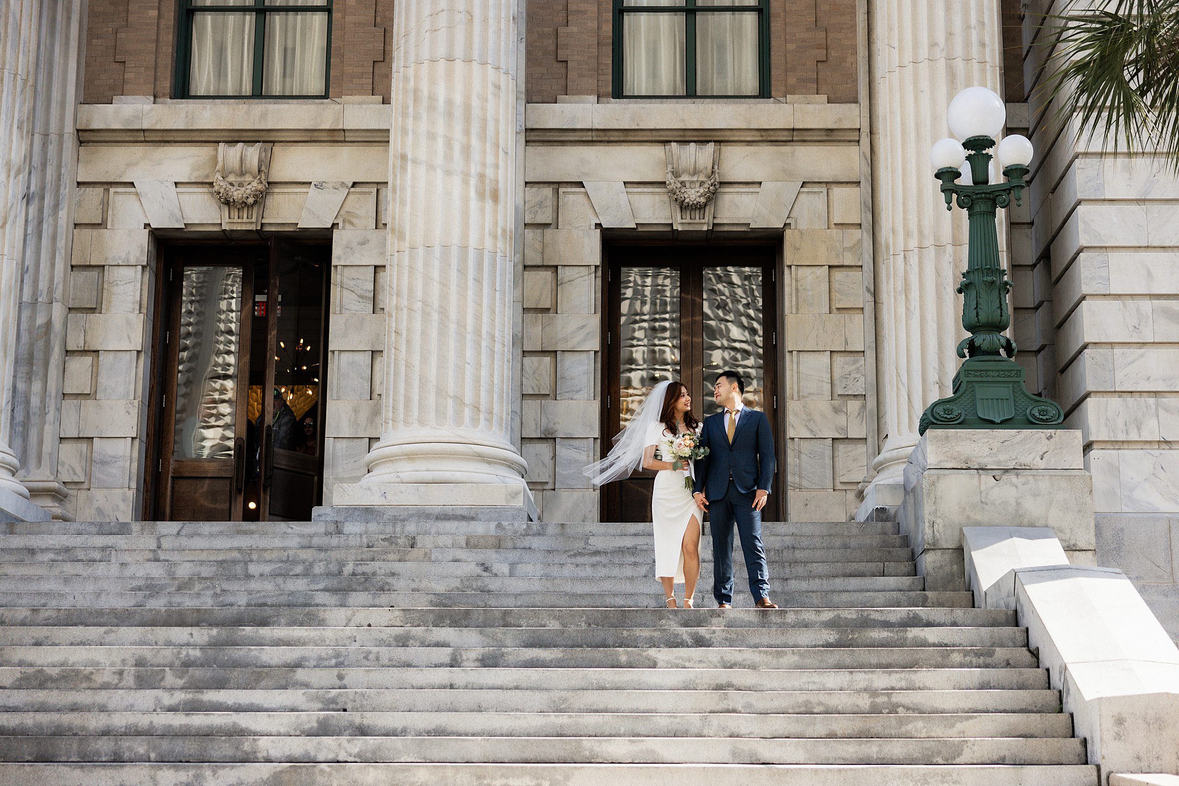 couple outside the Le Méridien after their downtown tampa wedding