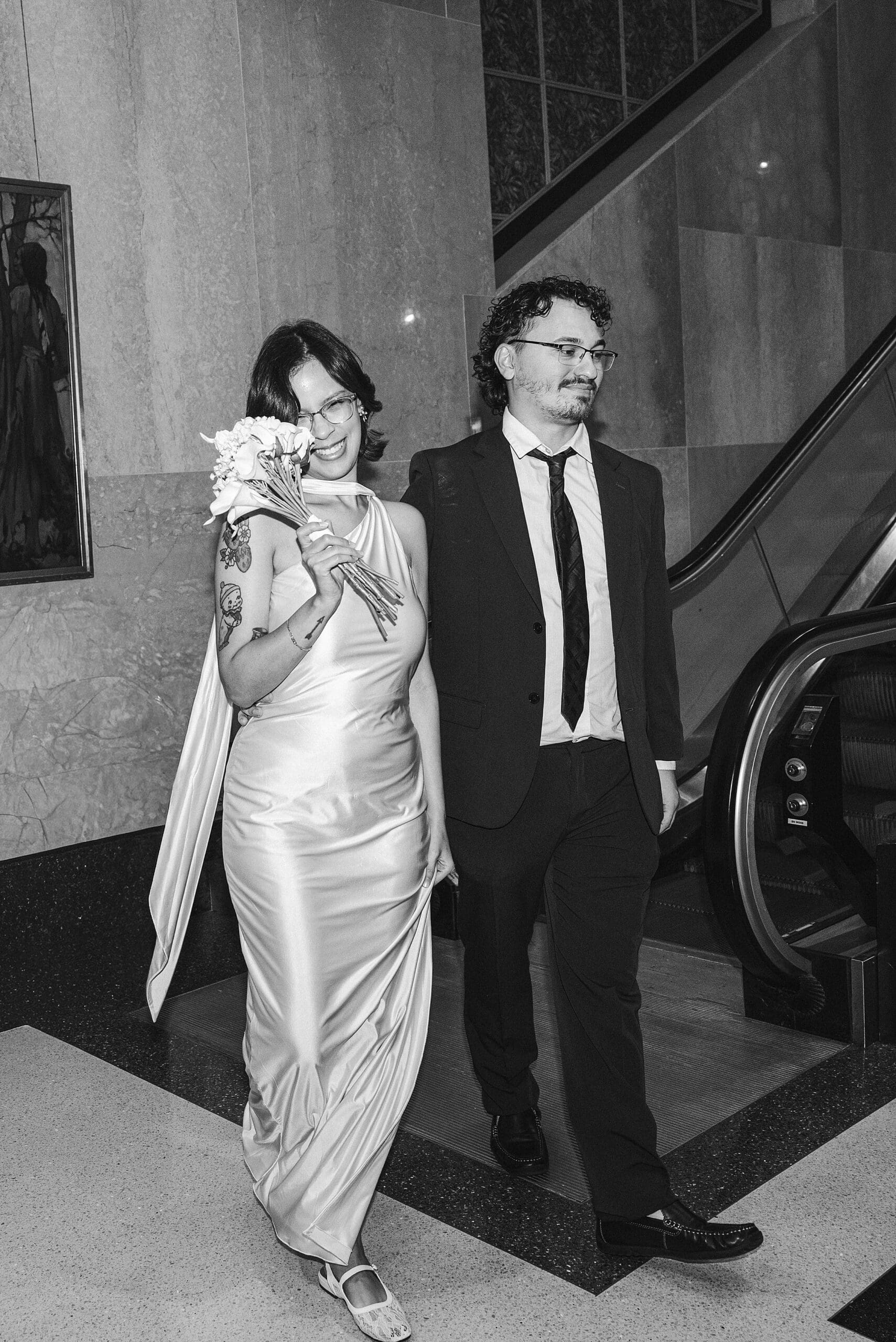 black and white flash photo of a couple inside the orange county courthouse in downtown orlando