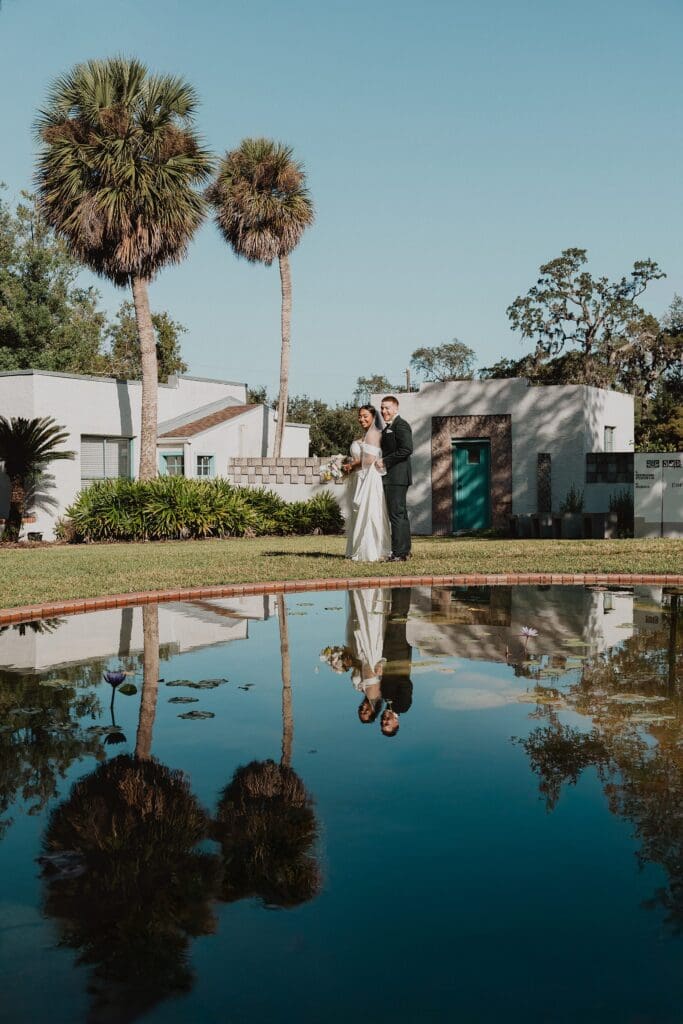 intimate couple portrait in front of a pool at a micro wedding at Maitland Art and History Center captured by Gracie May Photography
