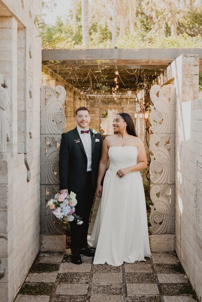intimate couple portrait inside a stone archway at a micro wedding at Maitland Art and History Center captured by Gracie May Photography