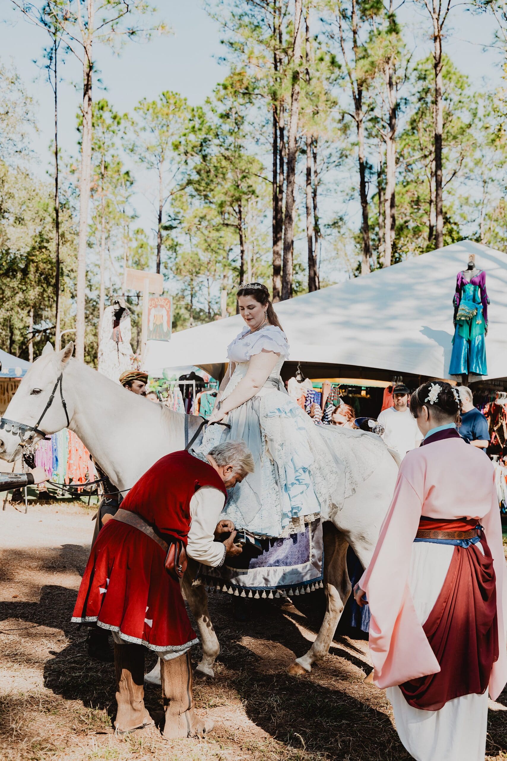 bride in renaissance attire on horseback at her wedding at the Lady of the Lakes Renaissance Faire near Orlando, Florida, captured by Gracie May Photography