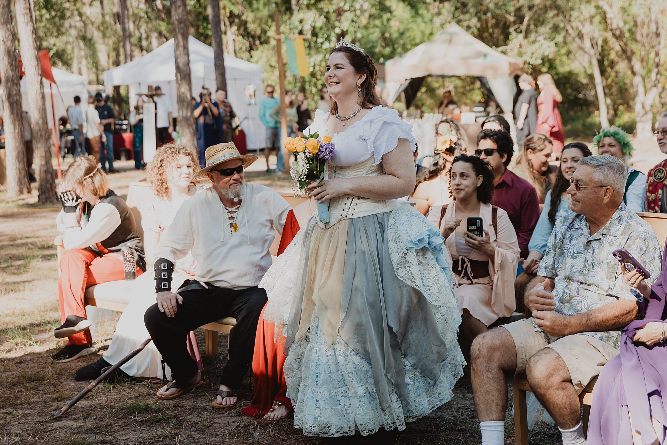 bride in renaissance attire at her wedding at the Lady of the Lakes Renaissance Faire near Orlando, Florida, captured by Gracie May Photography