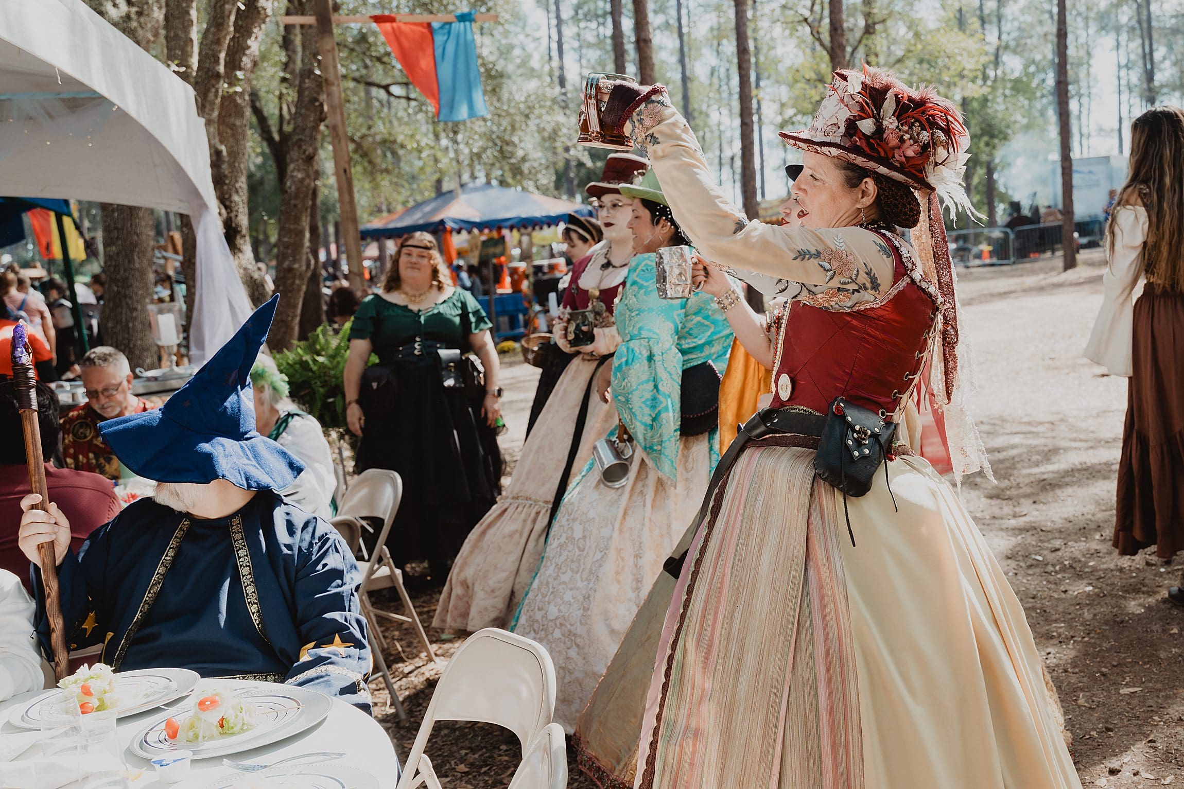 singers in renaissance attire at a wedding reception feast at the Lady of the Lakes Renaissance Faire near Orlando, Florida, captured by Gracie May Photography