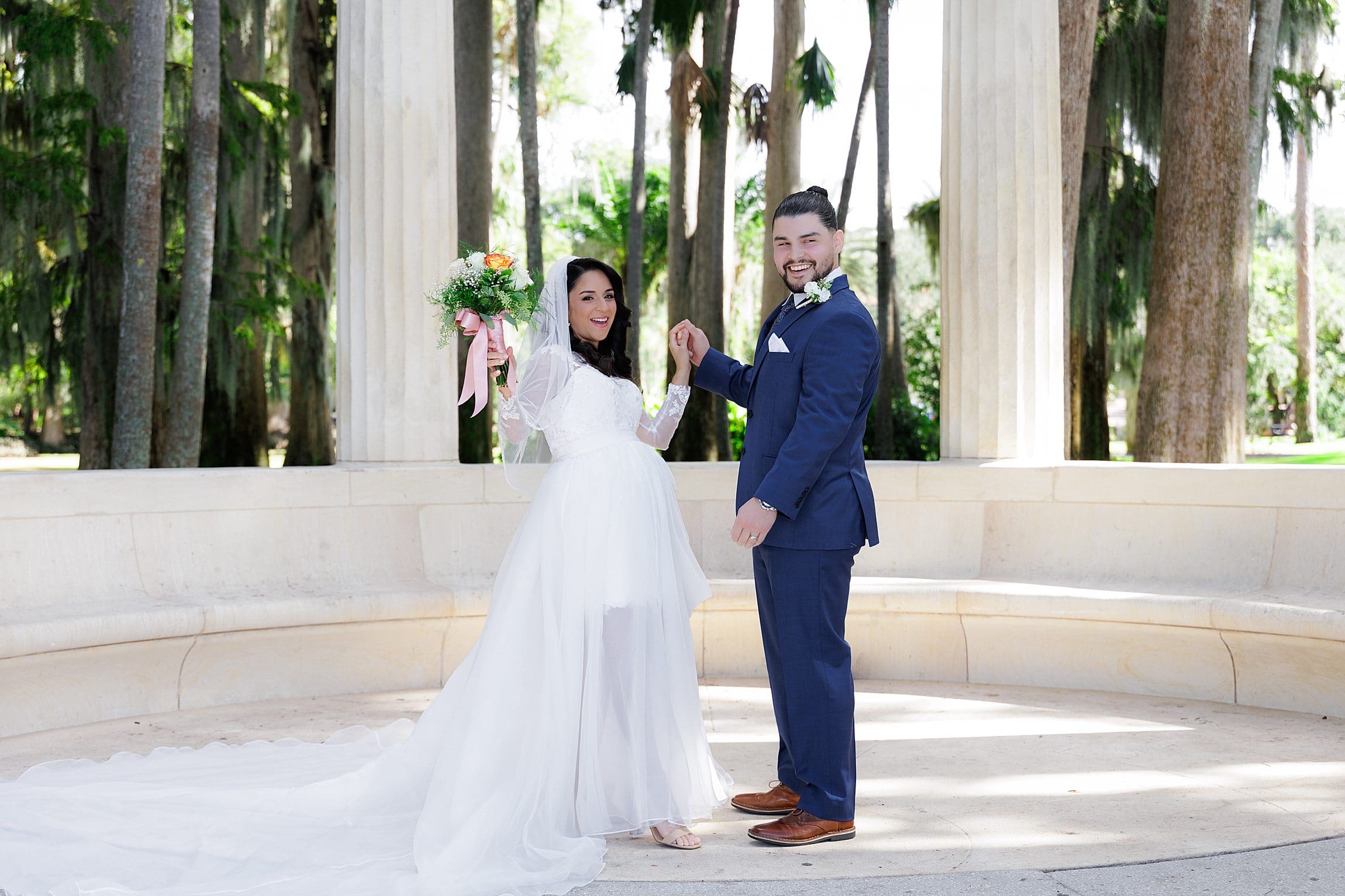 couple celebrating straight after being pronounced married during their micro wedding at kraft azalea garden in winter park