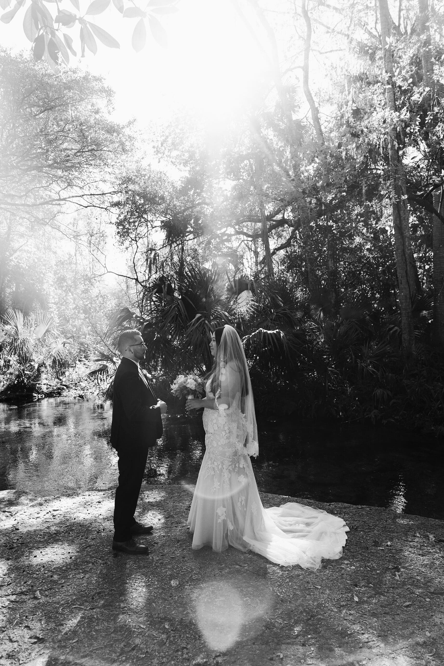 black and white photo of a couple during their Central Florida wedding elopement ceremony at Kelly Park Rock Springs