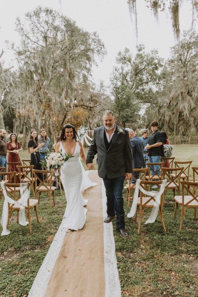 bride and groom during their backyard wedding ceremony in Mount Dora, Florida, captured by microwedding photographer Gracie May Photography