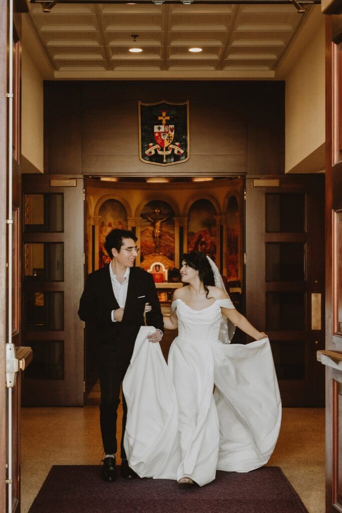 bride and groom pose outside of St. James Cathedral in Orlando after their micro wedding ceremony captured by Gracie May Photography
