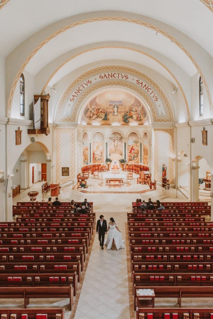 bride and groom during their micro wedding ceremony at St. James Cathedral in Orlando captured by Gracie May Photography