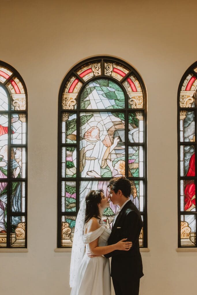 bride and groom during their micro wedding ceremony at St. James Cathedral in Orlando captured by Gracie May Photography