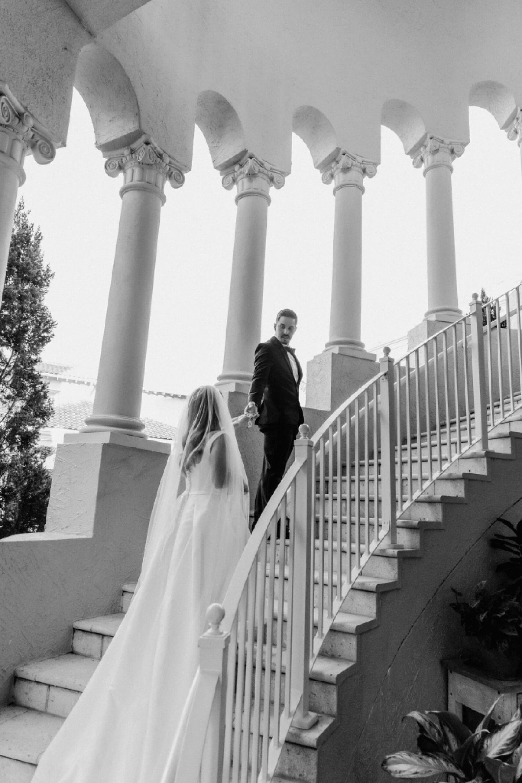 b&w photo of a bride and groom during their wedding photos at the ritz carlton orlando