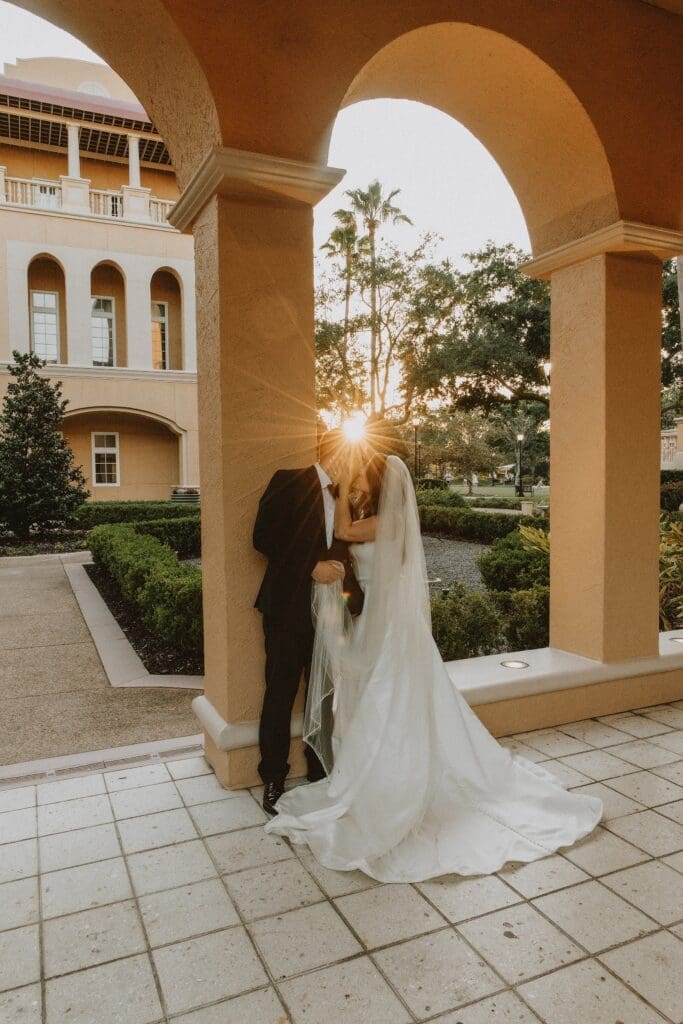 couple at sunset during their wedding photos at the ritz carlton orlando