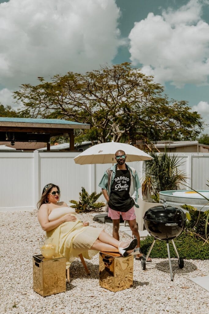 pregnant woman and man posing naturally and candidly during their retro lavender pregnancy maternity photoshoot captured by Gracie May Photography