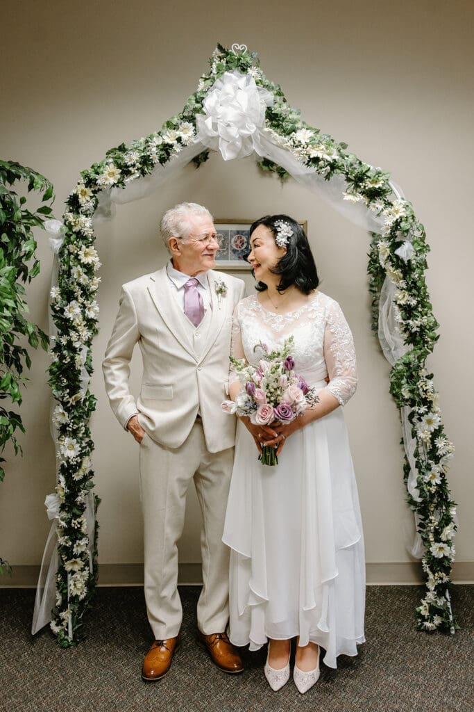 bride and groom during a wedding ceremony at Sumter County Clerk's Office in the Villages Florida, captured by Gracie May Photography