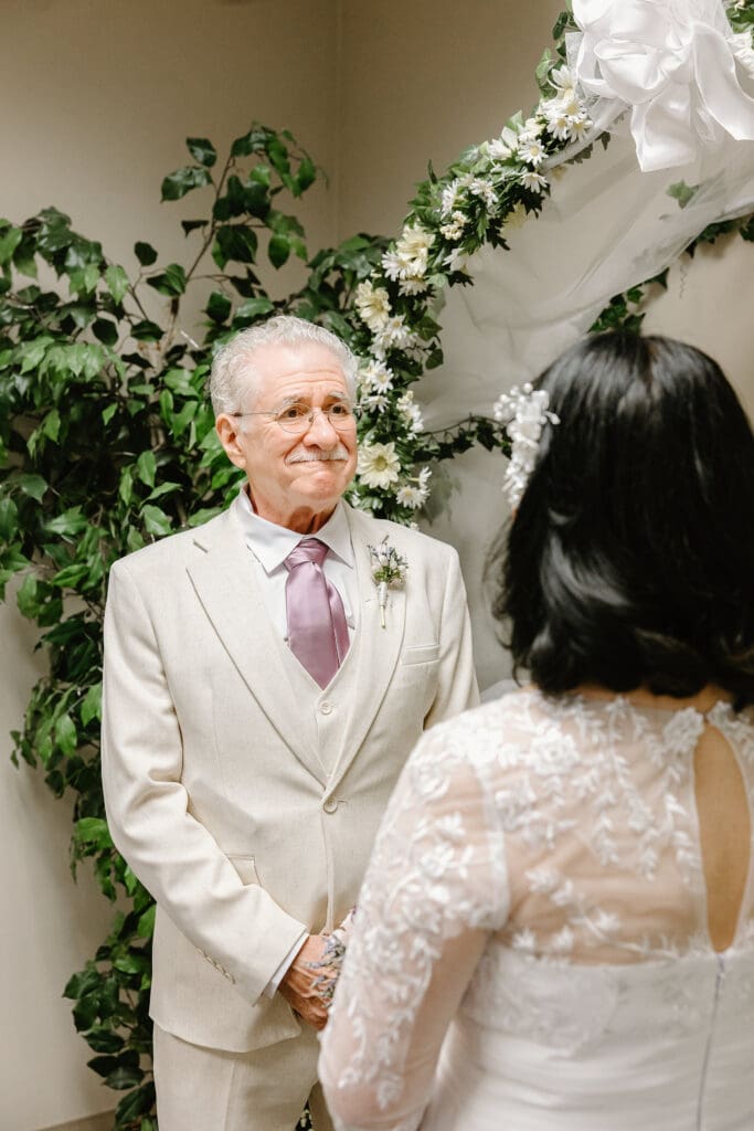 bride and groom during a wedding ceremony at Sumter County Clerk's Office in the Villages Florida, captured by Gracie May Photography