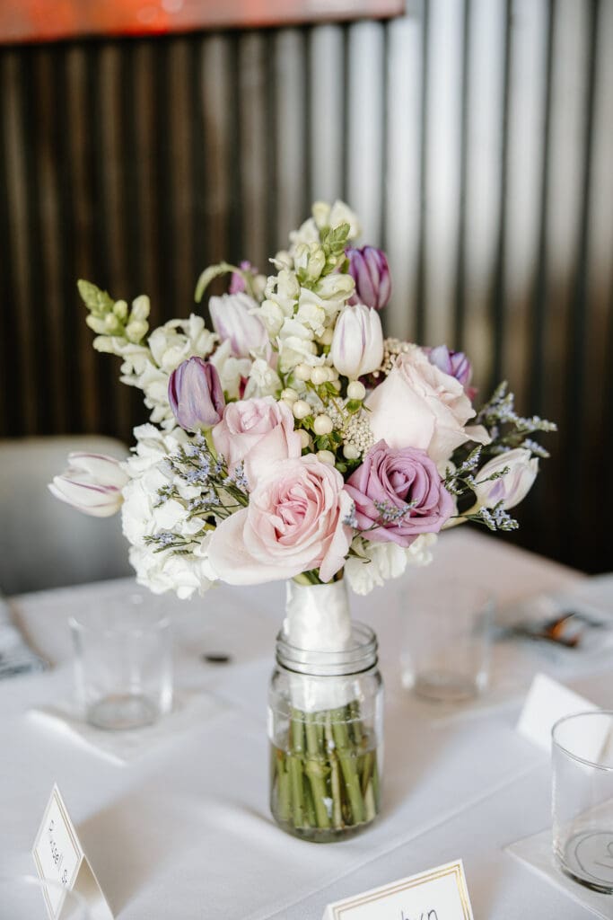 lavender centerpiece during a wedding reception at Wolfgang Puck Kitchen + Bar in the Villages Florida, captured by Gracie May Photography