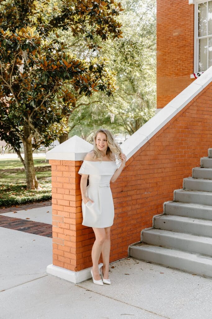 outdoor portrait of a bride in front of the Osceola Country Courthouse for her courthouse wedding, captured by Gracie May Photography.