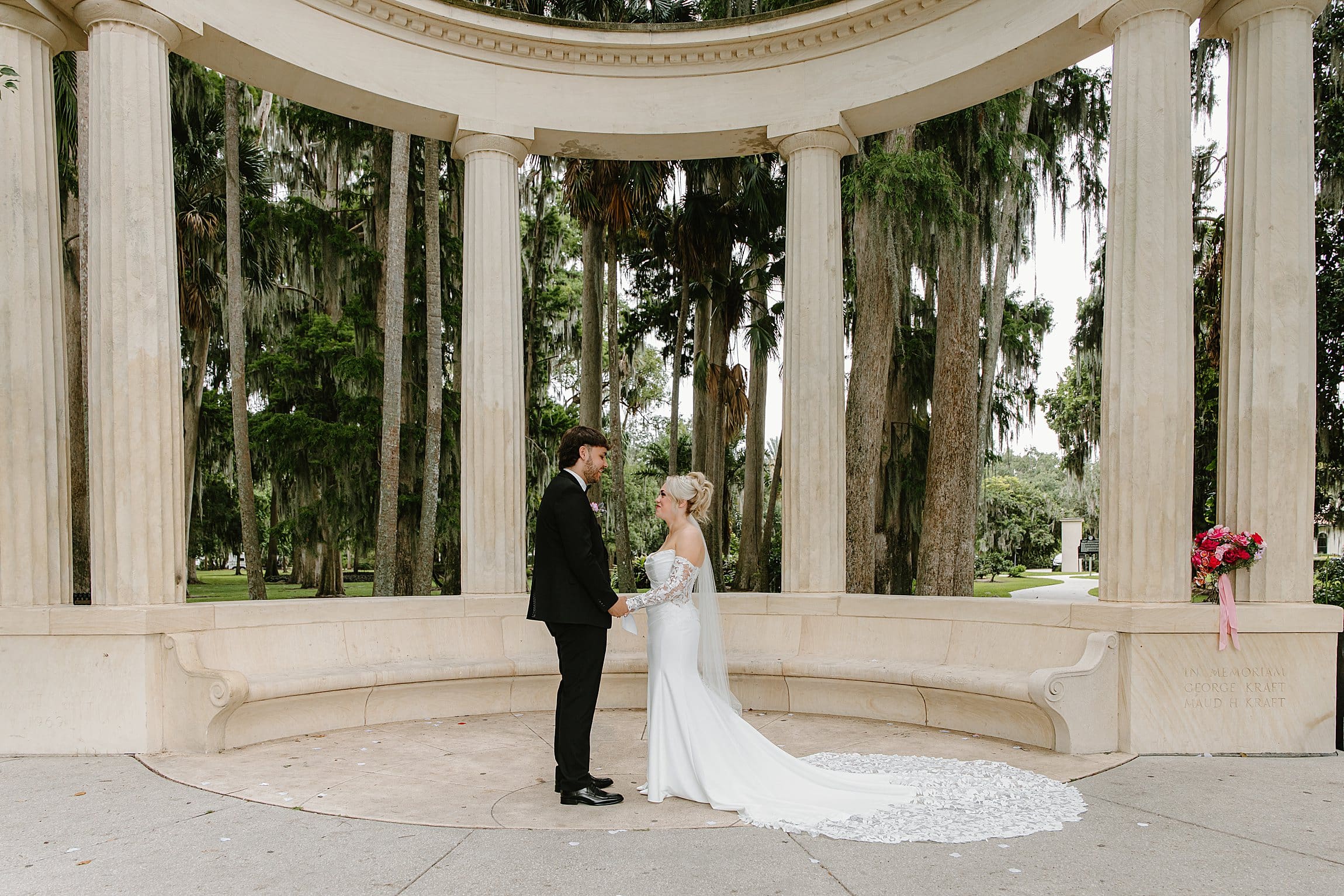 bride and groom at an elopement at the Exedra Monument at Kraft Azalea Garden in Winter Park, Florida, captured by Gracie May Photography