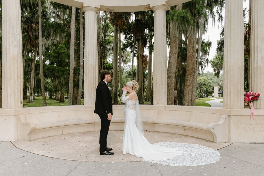 bride and groom at an elopement at the Exedra Monument at Kraft Azalea Garden in Winter Park, Florida, captured by Gracie May Photography