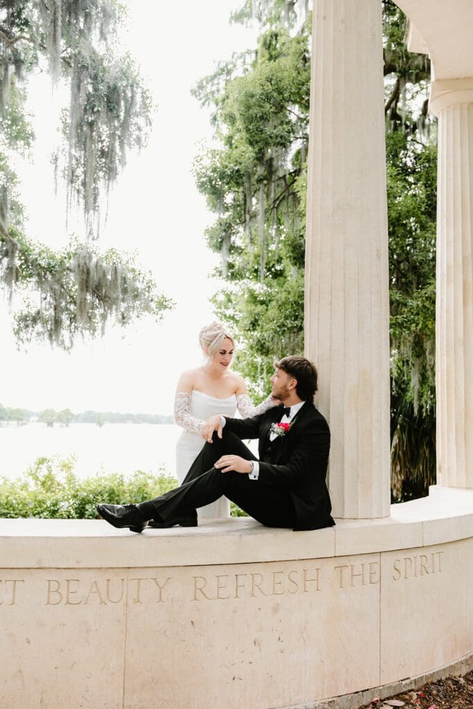 bride and groom at an elopement at the Exedra Monument at Kraft Azalea Garden in Winter Park, Florida, captured by Gracie May Photography