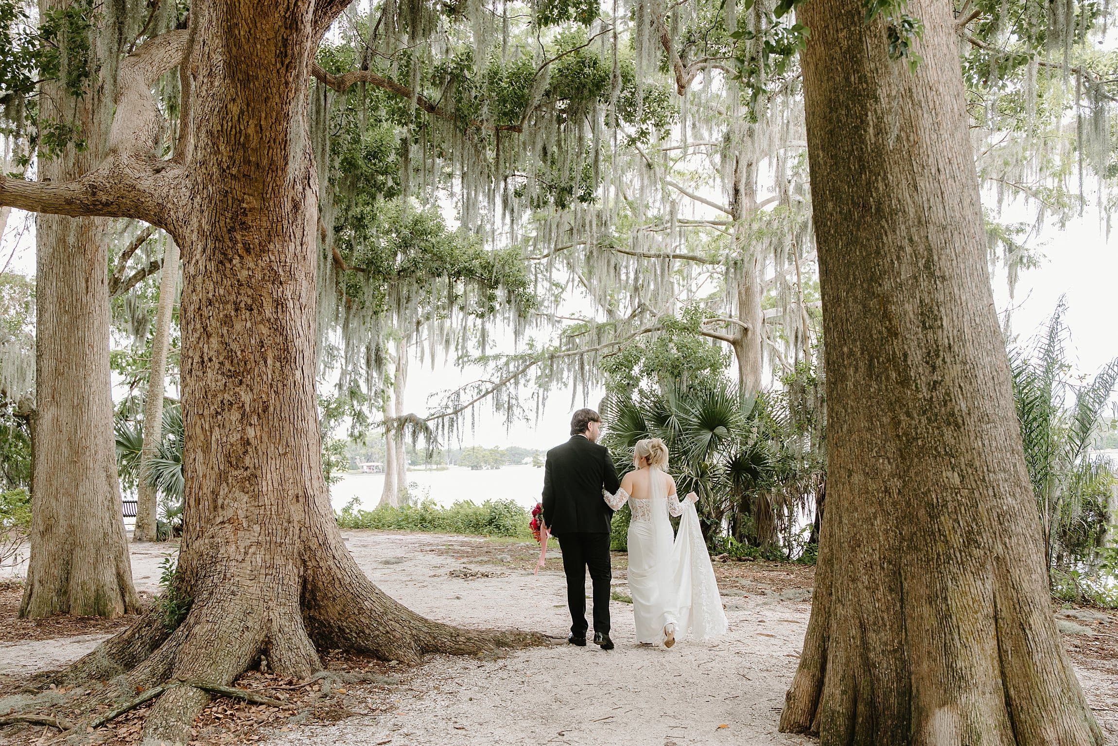 bride and groom at an elopement at Kraft Azalea Garden in Winter Park, Florida, captured by Gracie May Photography