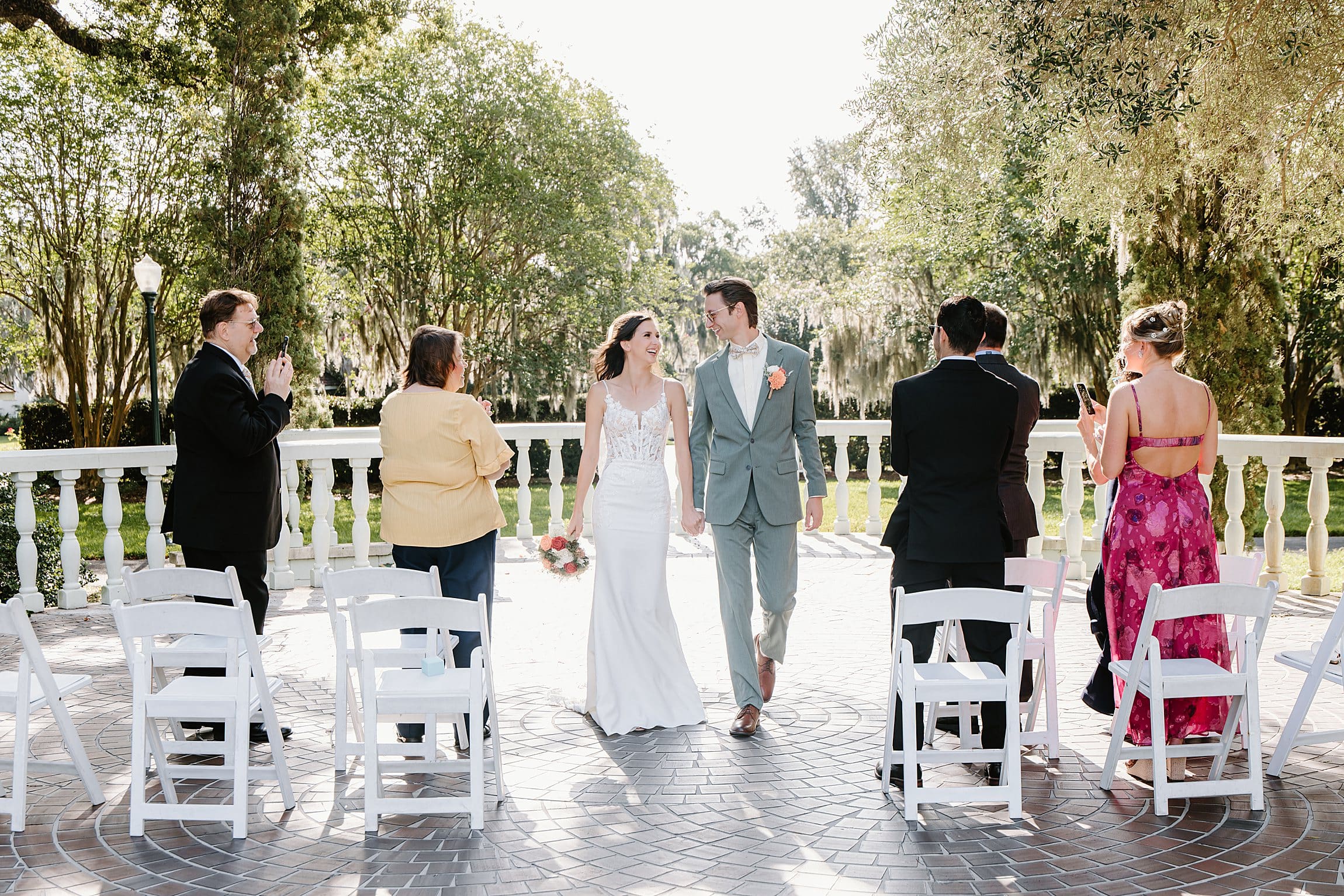 bride and groom and their 6 guests from their nano wedding at Harry P. Leu Gardens in Orlando, captured by micro wedding photographer Gracie May Photography.