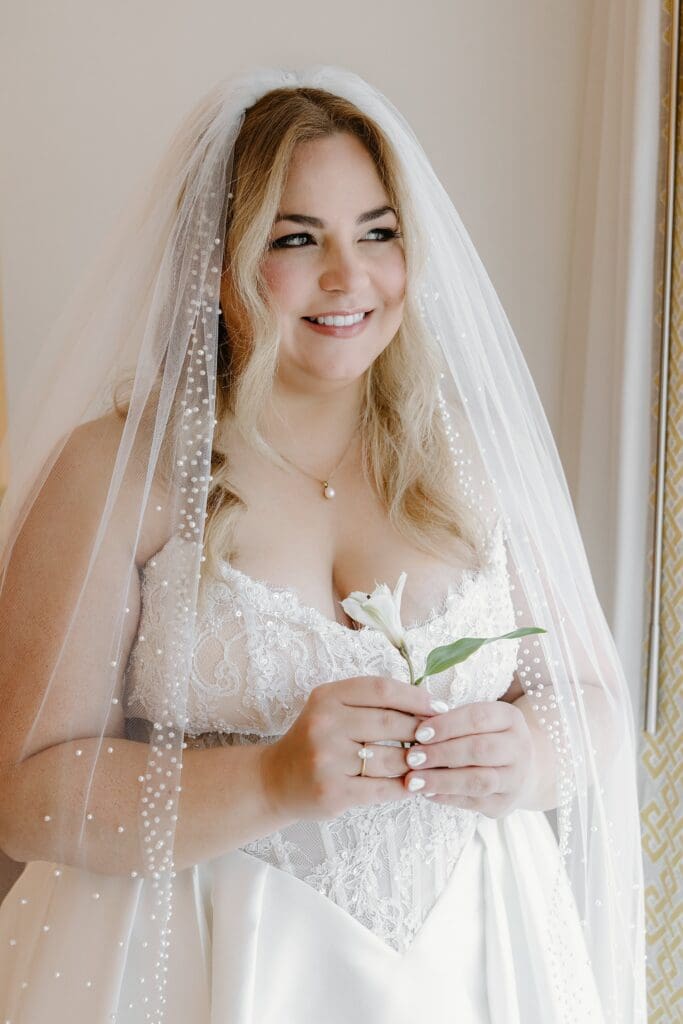 bride getting ready in a room at the alfond inn in winter park