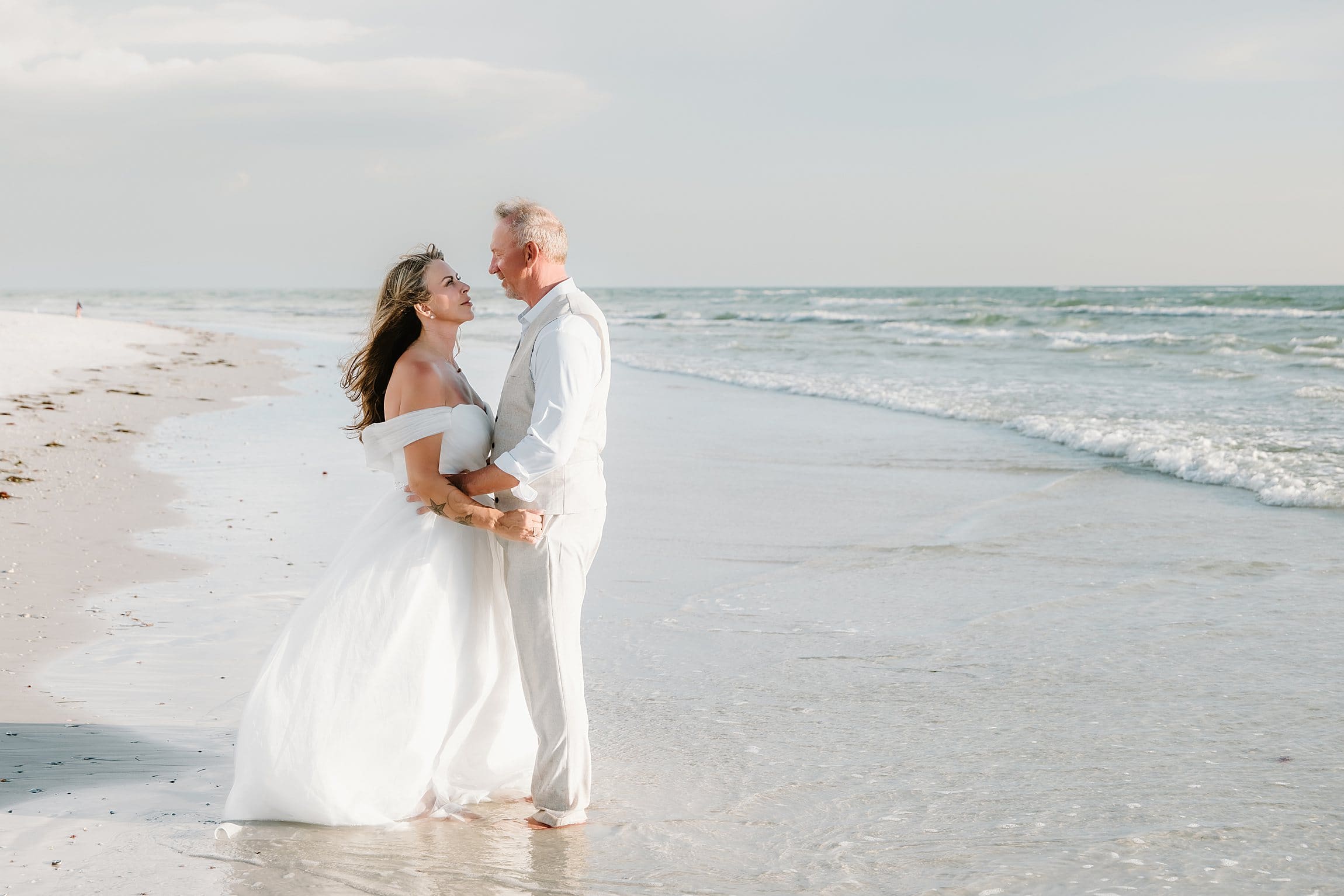 couple on the beach during their elopement wedding on siesta key sarasota