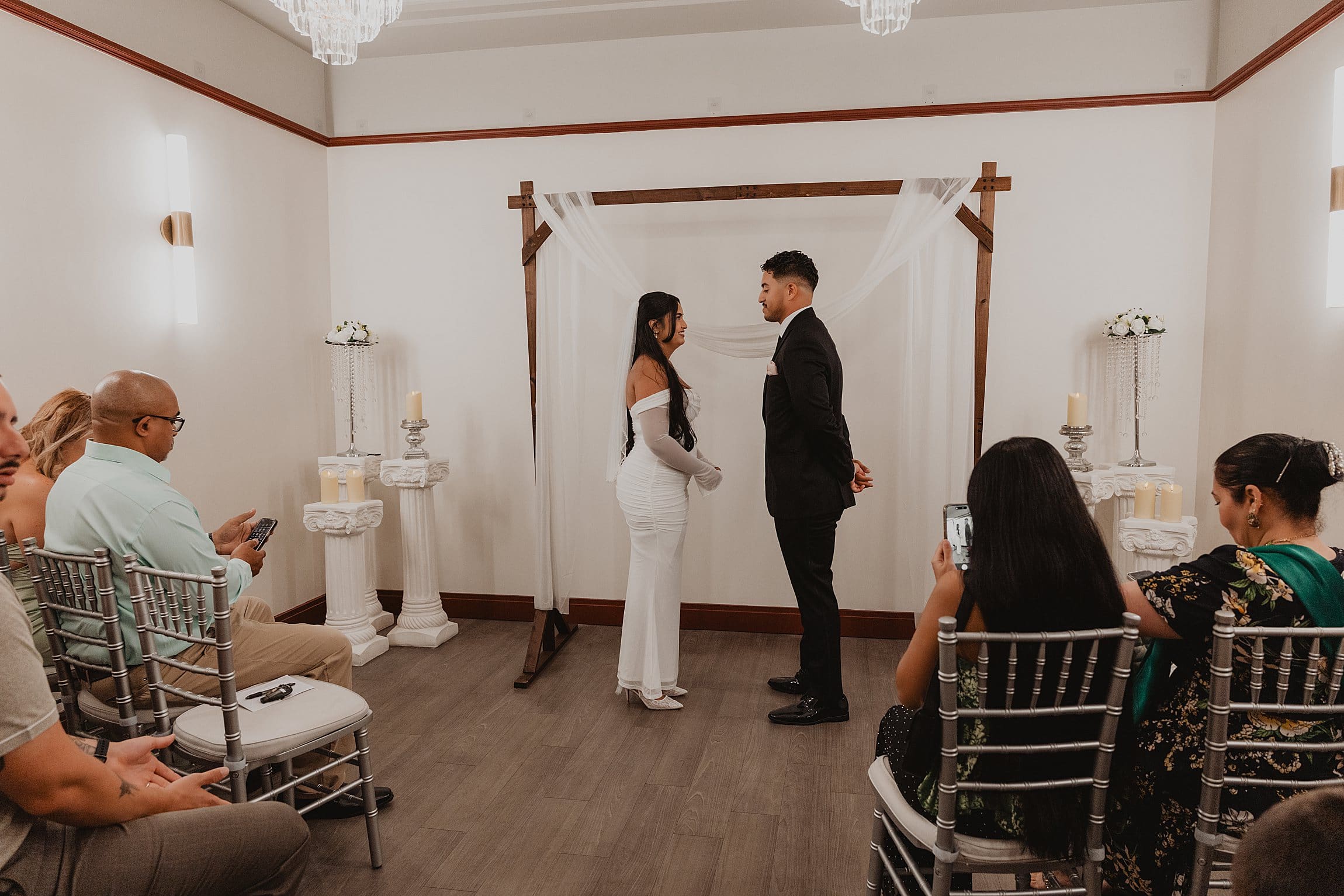 couple getting married in the newly decorated ceremony room at the orange county courthouse in downtown orlando