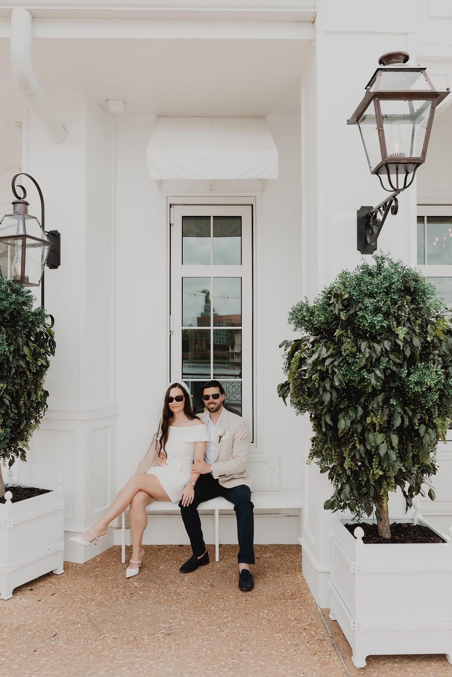 couple outside of the cake bake shop at the disney boardwalk after their orlando courthouse wedding